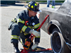 Firefighter Cuts a Hole in a Car