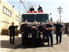 Members of Fire Department Standing in Front of Fire Truck